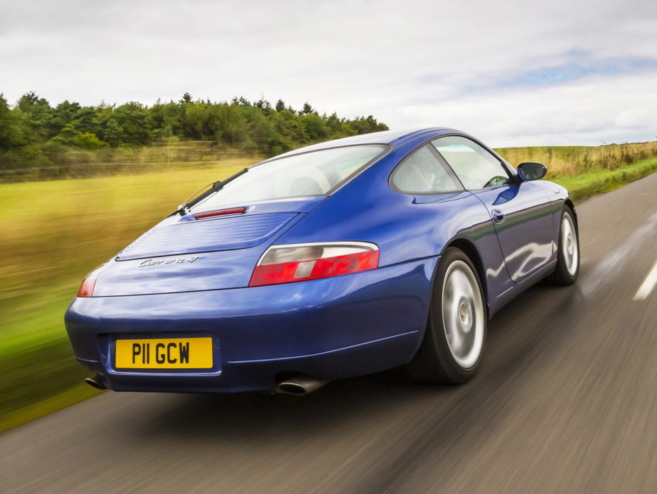 Blue Porsche 996 Carrera 4 driving